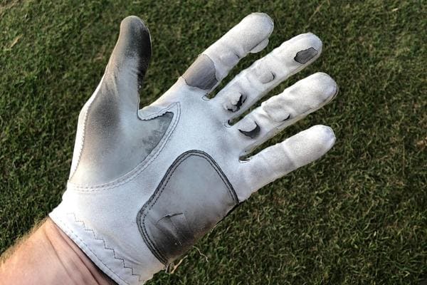 A worn golf glove