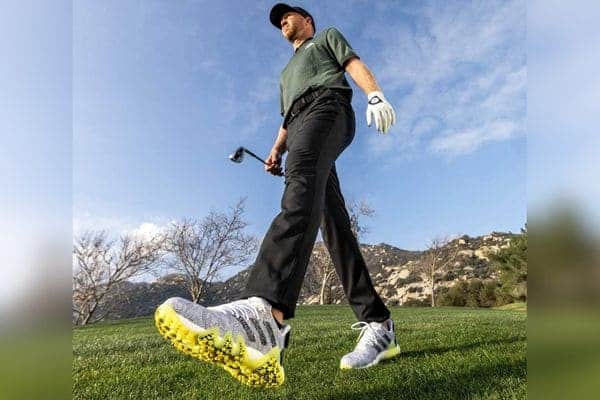 Golfer walking in snug golf shoes
